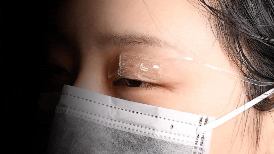 Animated eyelid assistive device in use